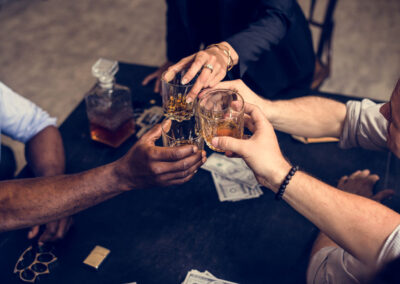 Hand toasting an alcohol together